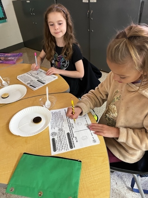 All week the 3rd and 4th grade classes have been studying weathering and erosion. Today the classes had their STEM activity. They used water and a toothpick to erode and weather a cookie (their "rock"); they drew their observations onto their papers. The students had so much fun today.